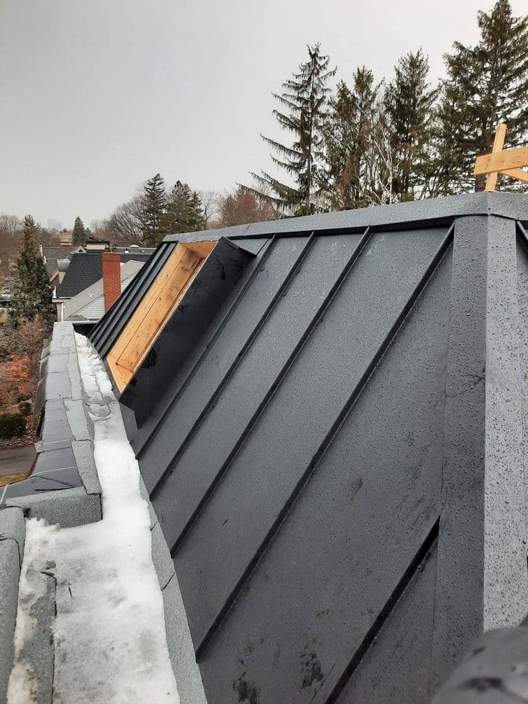Onyx Black Standing Seam and Inlet Gutter for Day Custom Homes