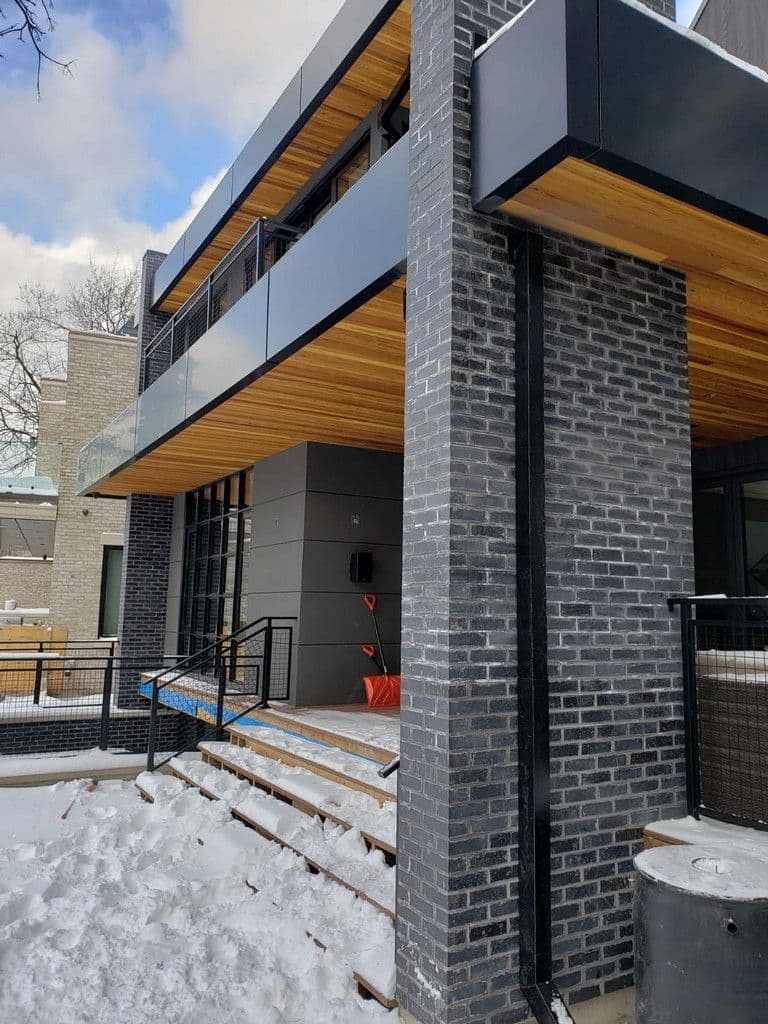 ACM Panel and Steel Square Downpipes for Day Custom homes