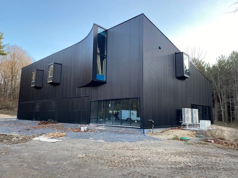 GH3 Architecture -- Pure Building Group Builder -- Corrugated Siding Installation 2